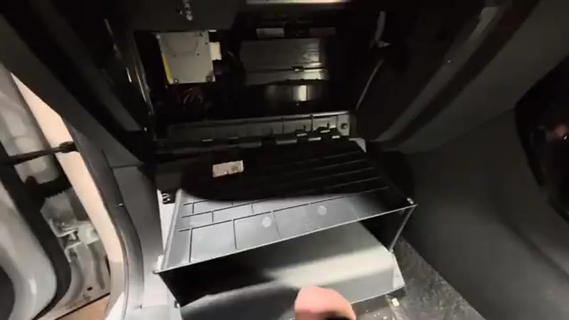 Refitting the cover and lifting the glove box back into place on the MG ZS