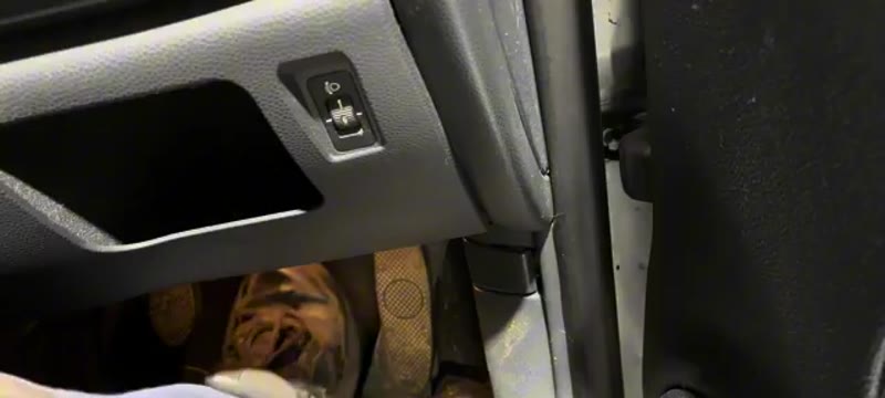 Testing the brake pedal in the Mini Cooper footwell after bleeding the system