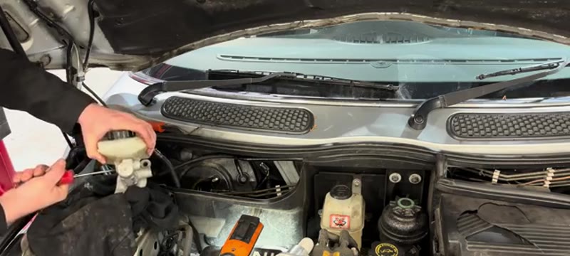 Transferring the fluid reservoir onto the new brake master cylinder for the Mini Cooper