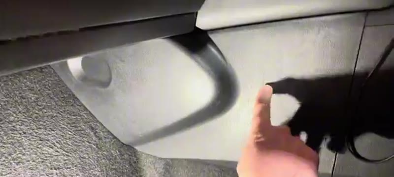 Locating the trim panel in the passenger footwell of a Nissan Qashqai