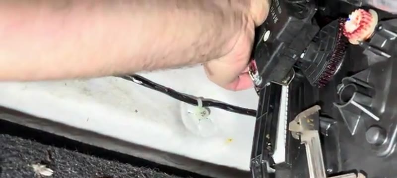 Sliding the access cover back into place on the Nissan Qashqai after fitting the filter