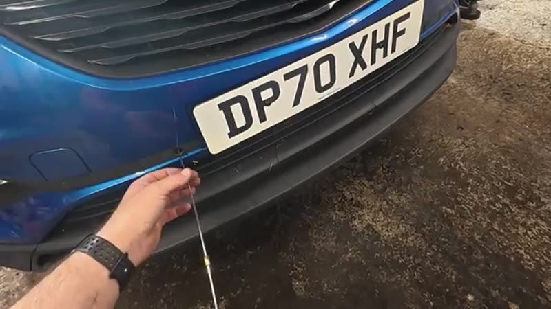 Checking the sensor below the number plate - the silent one is the faulty sensor