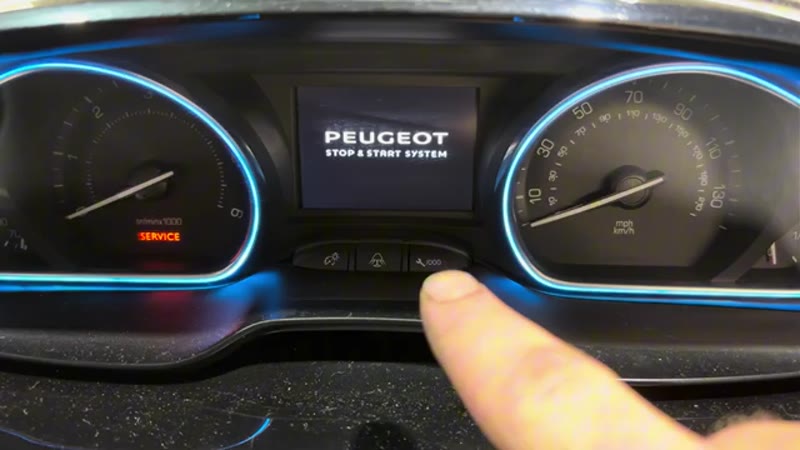 Pressing and holding the trip reset button below the display on the Peugeot dashboard