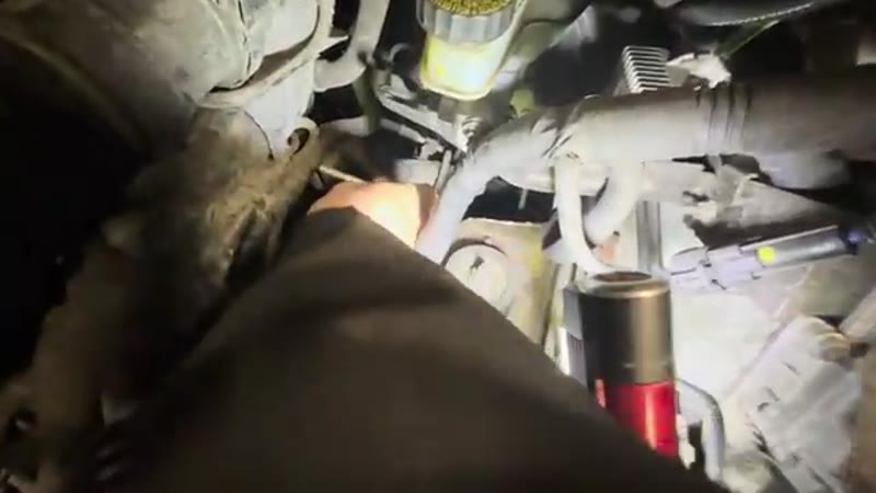 Reaching down past the pipes in the engine bay to feel for the top 6mm Allen bolt on the starter motor