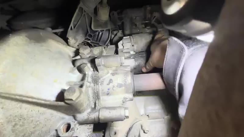 Wiggling the old starter motor free from the side of the gearbox
