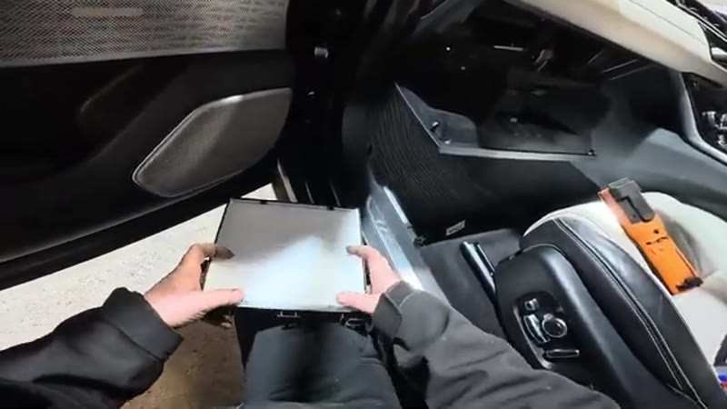 Fitting the new pollen filter with the airflow arrow pointing upwards on a Range Rover Velar