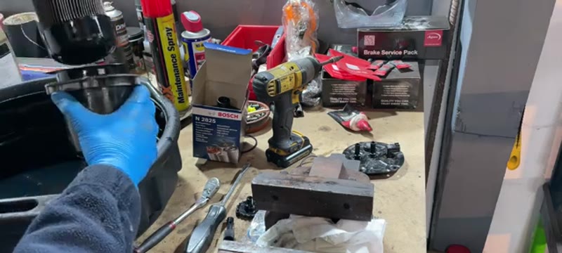 Pulling the old diesel fuel filter element out of the housing