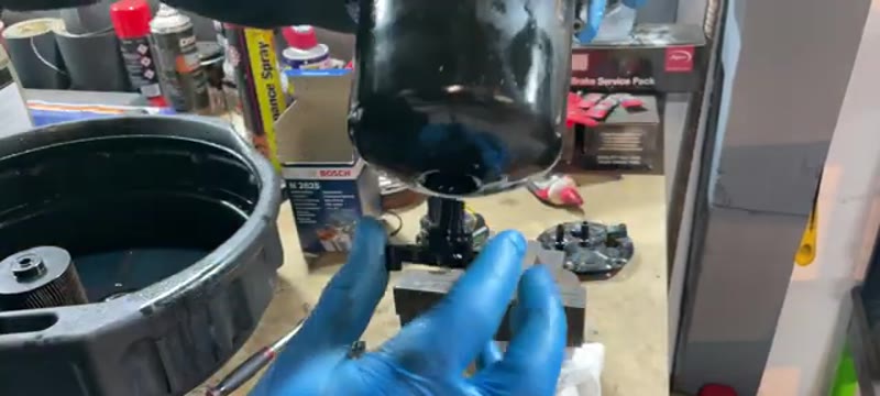 Fitting the new Bosch fuel filter element and O-rings into the housing