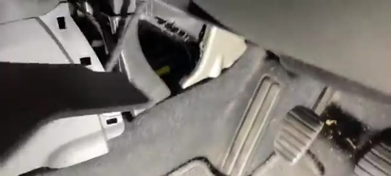 Lower footwell panel removed on a Renault Megane Mk3 showing the retaining clips