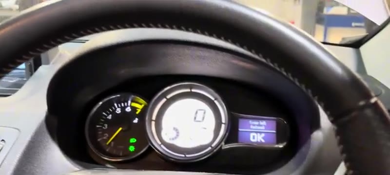 Testing the wiper stalk from the driver's seat of a Renault Megane to confirm the fault