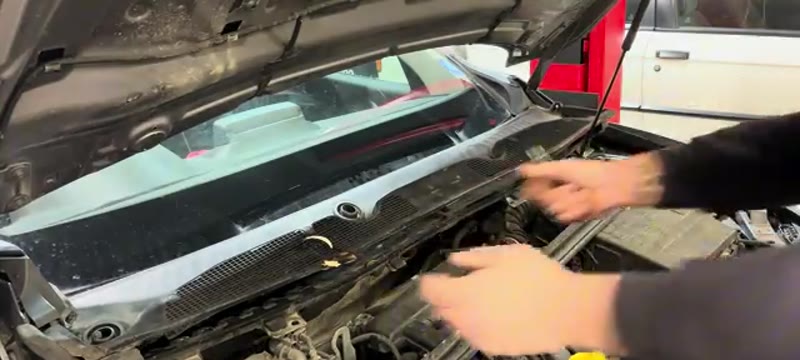 Pulling off the weather strip and scuttle panel to reach the Megane wiper linkage