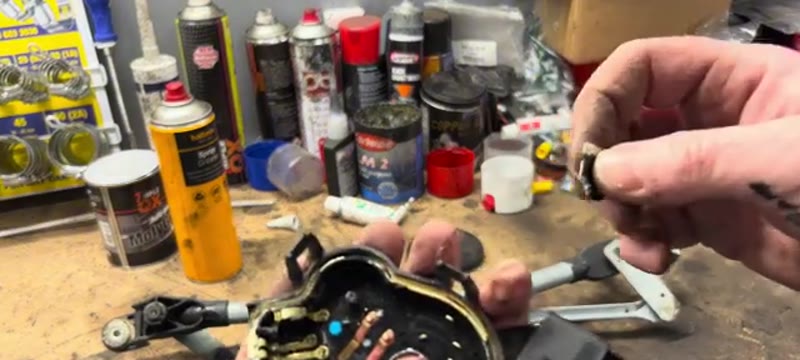 Cleaning the corroded earth contacts inside the wiper motor with sandpaper