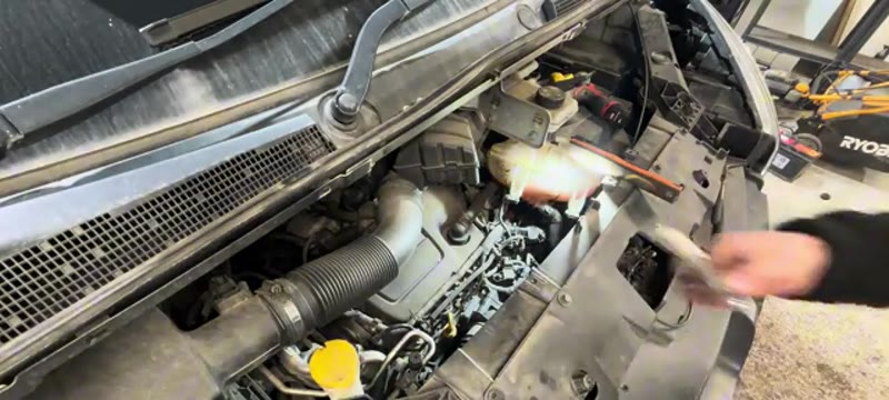 Feeding the 10mm socket and extension bar down onto a glow plug