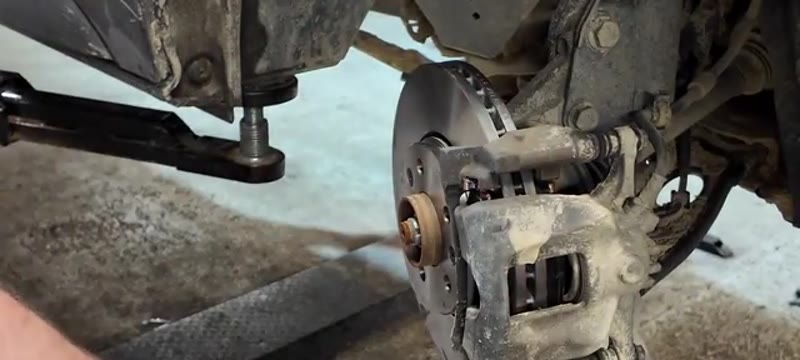 Caliper refitted over the new disc and pads on the Renault Trafic 2022