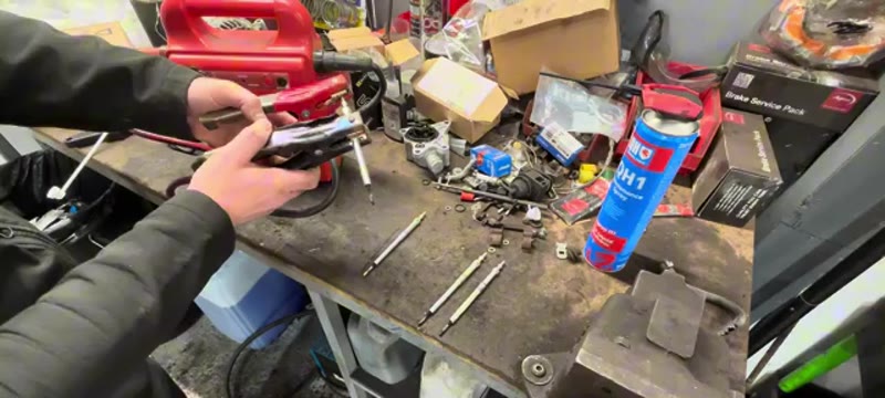 Testing an old glow plug on the bench with a jump pack to see if it glows
