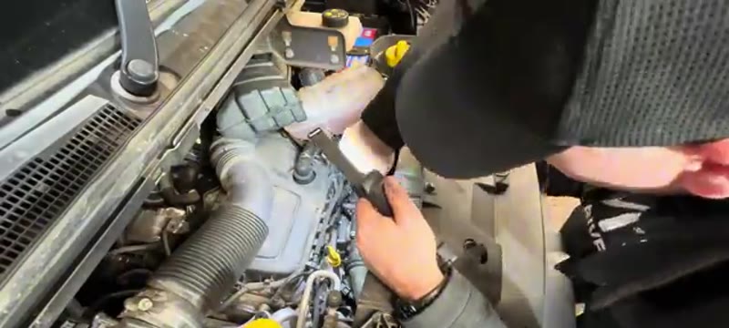 Clicking the connectors back onto the new glow plugs with pliers on the Renault Trafic