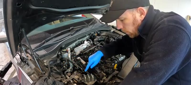 Stripping the pipework and covers from the top of the Skoda Superb engine bay