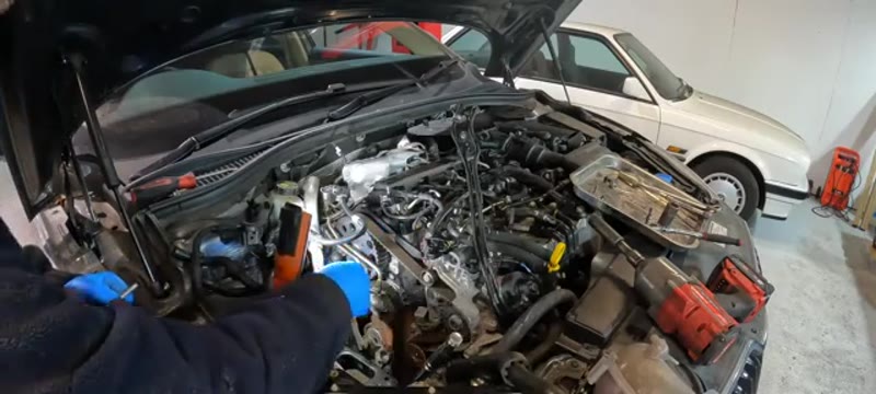 Camshaft locking tools installed across the timing area on the Superb engine