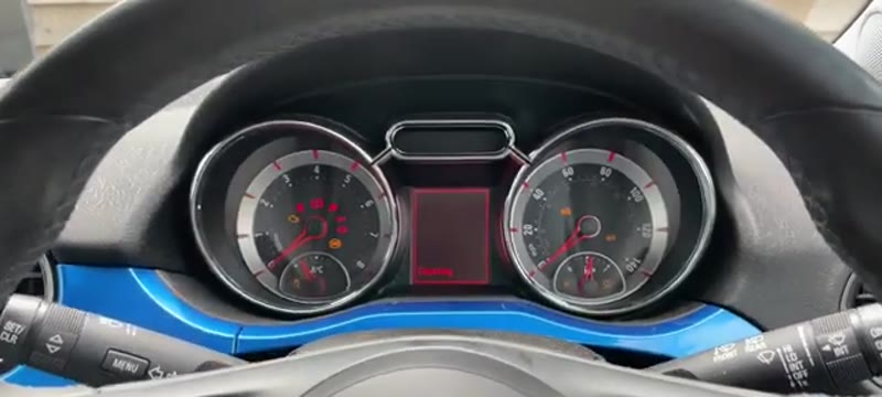 Vauxhall Adam instrument cluster with the ignition on showing the change oil soon message