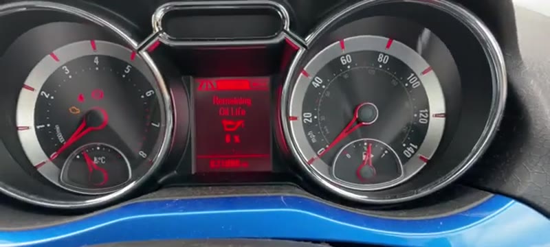 Scrolling to the Oil Life Remaining screen on the Vauxhall Adam dash display