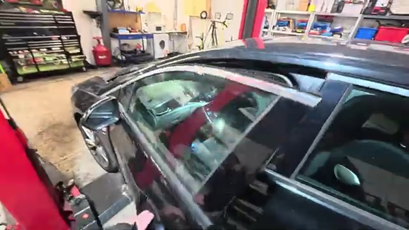 Walking around to the passenger side of a 2018 Vauxhall Astra to access the glove box