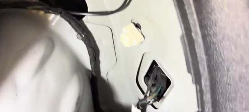 The two plastic fasteners that secure the rear light unit inside the Vauxhall Corsa boot