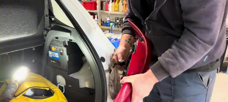Refitting the rear light unit to the Vauxhall Corsa after fitting the new bulb