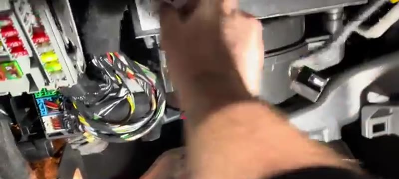 Clipping the pollen filter cover closed before refitting the Vauxhall Insignia glove box