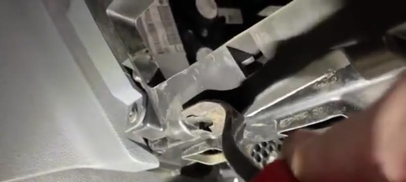 Releasing the clips on the small air duct section in the Vauxhall Vivaro footwell