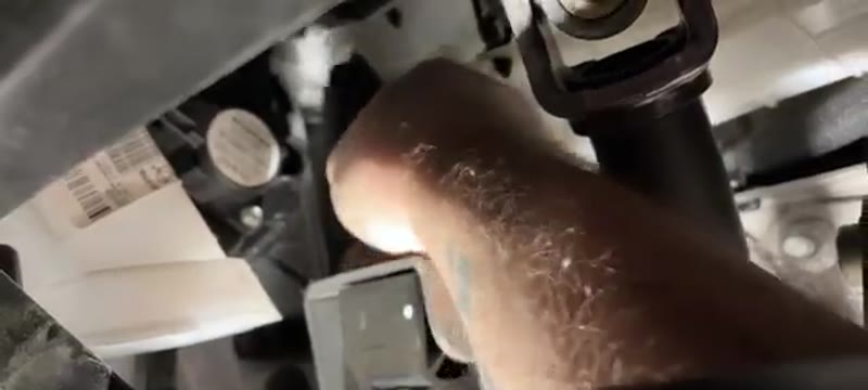 Reaching up and over the clutch pedal to open the pollen filter door on a Vauxhall Vivaro