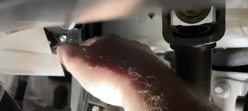 Refitting the pollen filter door above the clutch pedal on a Vauxhall Vivaro