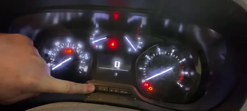 Holding the spanner button on the Vauxhall Vivaro instrument cluster while the ignition is switched on