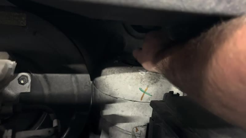 Undoing the 21mm top nut on the Vauxhall Vivaro front strut from inside the engine bay