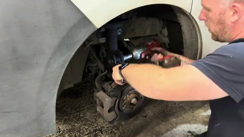 Removing the two 21mm bolts through the bottom of the Vauxhall Vivaro shock absorber