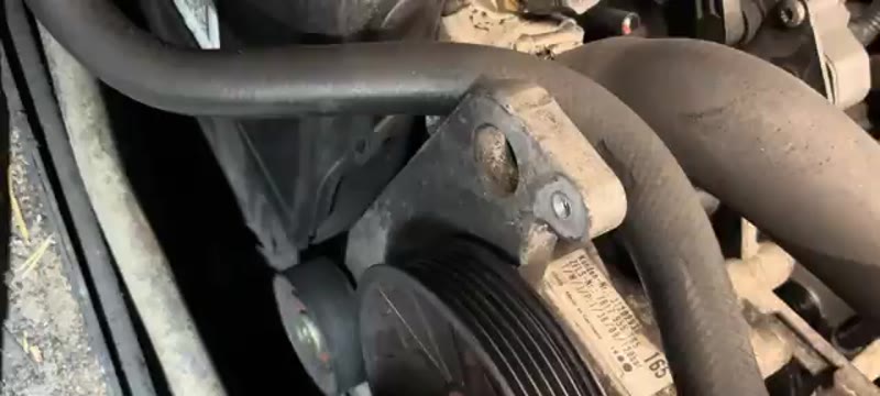 Side of the Volvo XC90 alternator beneath the power steering pulley where the single 10mm bolt sits