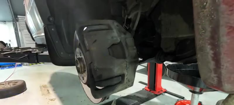 Front brake caliper and disc on a Volvo XC90 with the wheel removed ready for work
