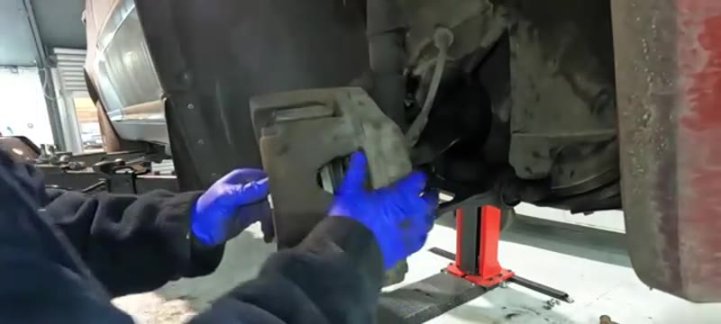 Sliding the Volvo XC90 caliper back over the new disc and pads