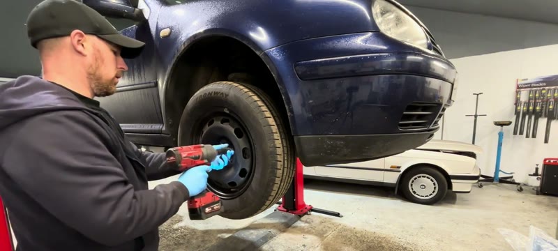 Removing the front wheel of the Mk4 Golf to reach the lower suspension arm
