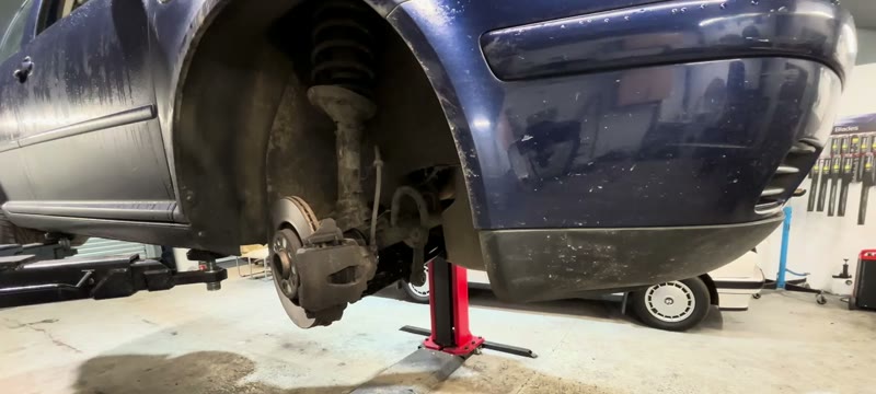 Tightening the Mk4 Golf lower arm bolts with the arm raised to ride height
