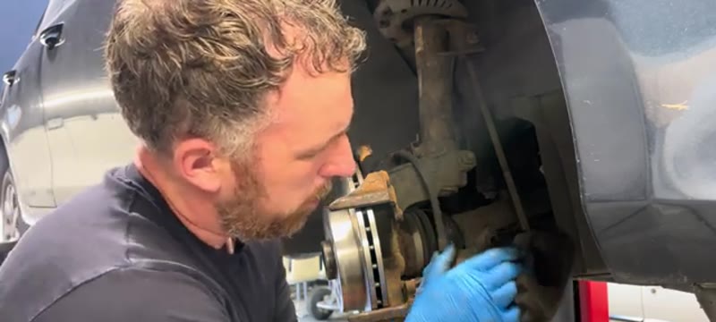 Fitting the new brake pads into the caliper