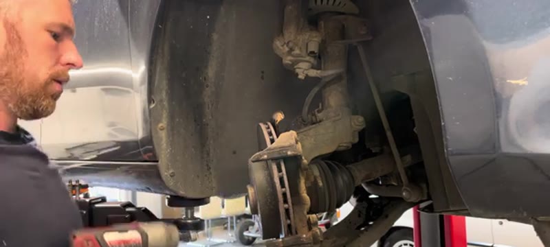 Removing the T30 Torx disc retaining screw with a driver