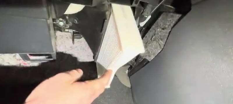 Pushing the new pollen filter up into position on the VW Polo