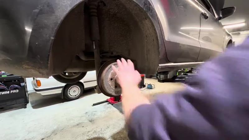 Undoing the T30 drum retaining screw on the rear hub of a VW Polo