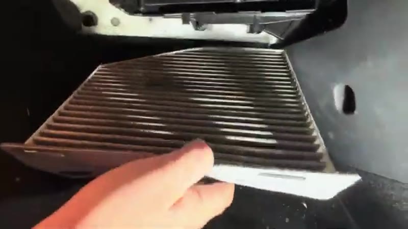 Sliding the dirty old pollen filter out of the VW Tiguan housing