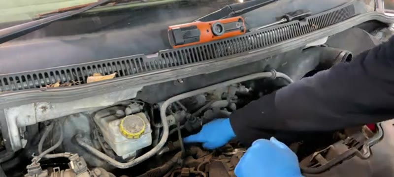 Disconnecting the top hose, vacuum line and electrical connector from the VW Transporter EGR cooler
