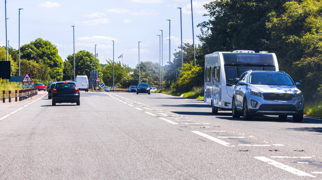 Car towing a caravan along the motorway